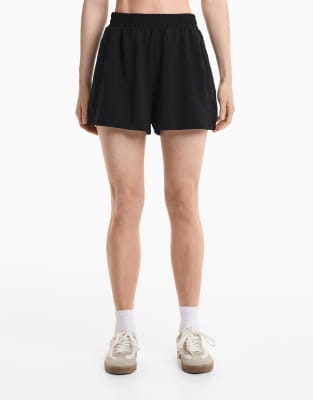 Oysho - Shorts in Schwarz aus weichem Modal und seitlichen Knöpfen