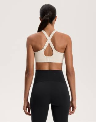 OYSHO - Sport-BH in zartem Ecru mit starkem Halt und überkreuztem Rückenträger-Design-Neutral