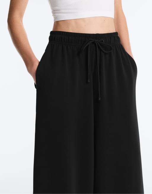 Oysho – Svarta, mjuka, vida byxor i modal med kort design, 2 av 4