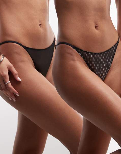 Pack de 2 braguitas de color negro y con patrón de lunares con laterales estrechos de malla de Weekday - view 1