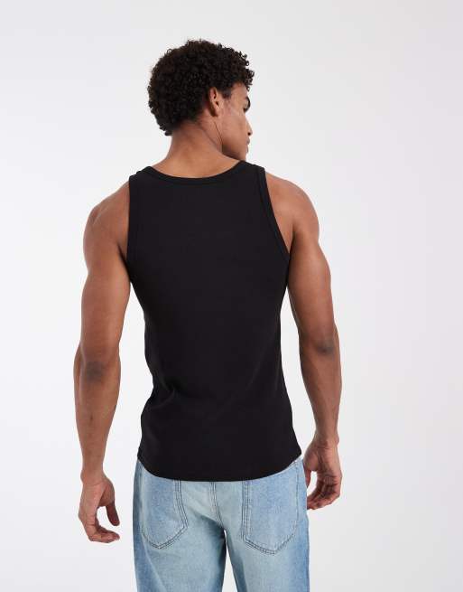 Pack de 2 camisetas de color negro y blanco sin mangas de corte slim de Tommy Jeans, 5 de 5