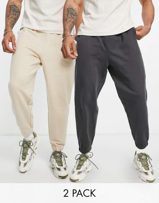 Pack de 2 joggers de color avena jaspeado y negro lavado de corte extragrande de ASOS DESIGN
