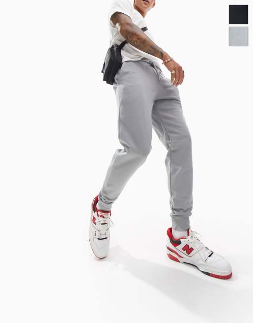 Pack de 2 joggers de corte tapered de color negro y gris jaspeado de ASOS DESIGN