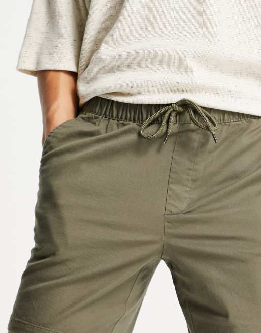 Pack de 2 pantalones cortos chinos de color caqui y beis de corte pitillo con cintura elástica de ASOS DESIGN, 3 de 4