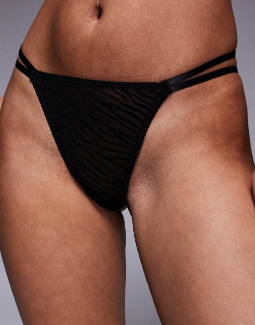 Pack de 2 tangas de color marrón y estampado animal con diseño de dos tiras de encaje de ASOS DESIGN, 3 de 4