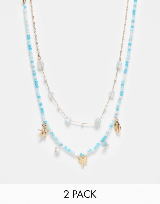 Pack de 2 collares de cuentas y perlas blancas y turquesas para festivales de DesignB London 