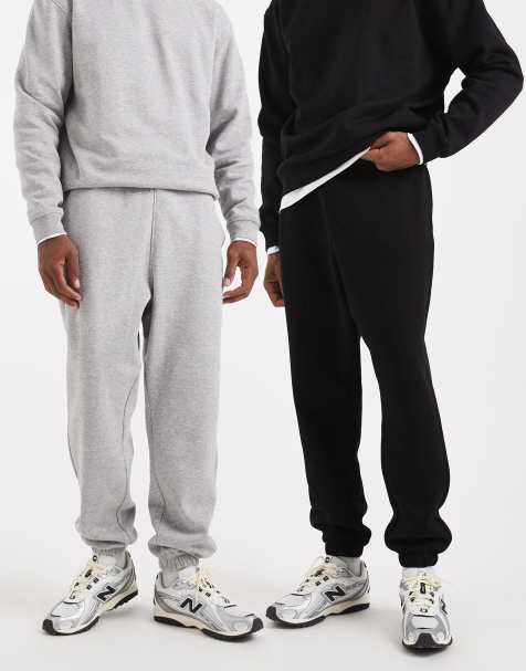 Pack de 2 joggers de color negro y gris jaspeado básicos extragrandes de ASOS DESIGN - view 1