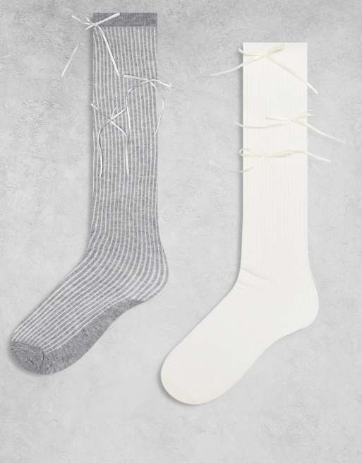 Pack de 2 pares de calcetines por la rodilla de color amarillo y gris de canalé con detalle de lazo de satén exclusivo de Kaiia