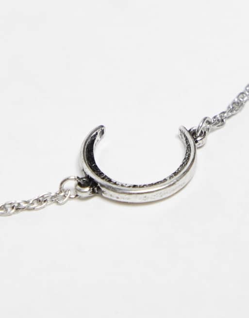 Pack de 2 pulseras plateadas con charm en tono pulido de sol y luna de ASOS DESIGN, 2 de 4