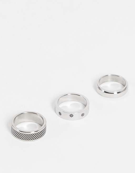 Pack de 3 anillos plateados con diseños grabados de flores de acero inoxidable resistente al agua de ASOS DESIGN 