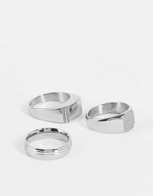 Pack de 3 anillos plateados con diseños variados tipo sello de acero inoxidable resistente al agua de ASOS DESIGN 