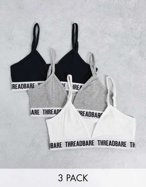 Pack de 3 bralettes de triángulo de color blanco, gris y negro con logo de Threadbare