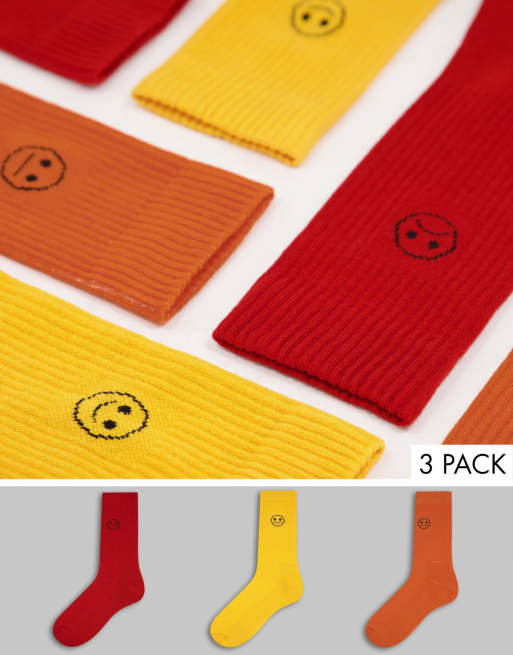Pack de 3 pares de calcetines deportivos en tonos otoñales con caras felices de ASOS DESIGN