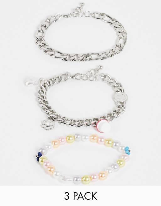 Pack 3 pulseras plateadas cadenas y pulsera de con perlas sintéticas coloridas y charms alegres de ASOS DESIGN | ASOS
