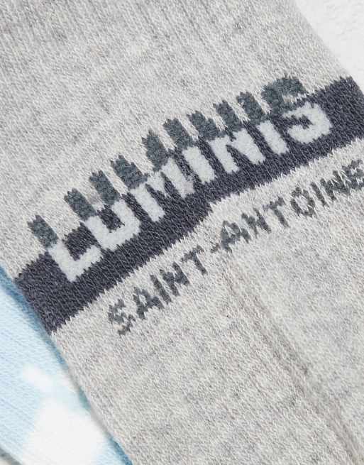 Pack de 3 pares de calcetines azules de caña alta con texto "Luminis" de River Island, 2 de 4