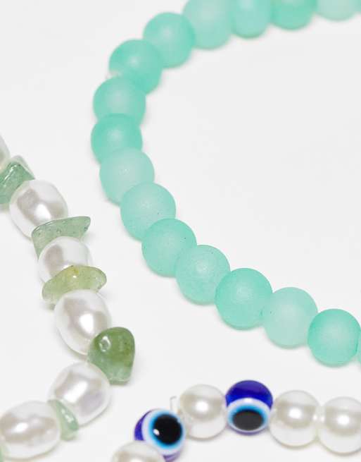 Pack de 3 pulseras con diseños en azul, verde y de ojo turco de perlas sintéticas y cuentas de ASOS DESIGN , 3 de 4