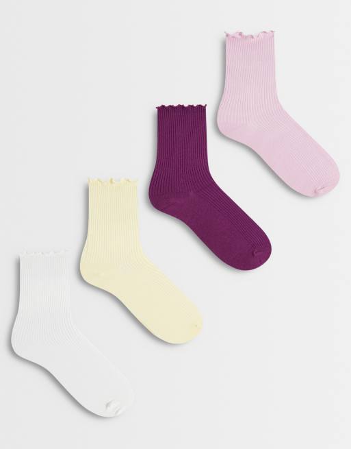 Pack de 4 pares de calcetines de varios colores de caña alta con ribete ondulado de canalé de Lindex, 1 de 3