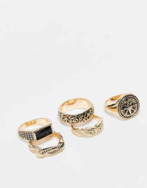 Pack de 5 anillos dorados con diseño de brújula y serpiente de ASOS DESIGN