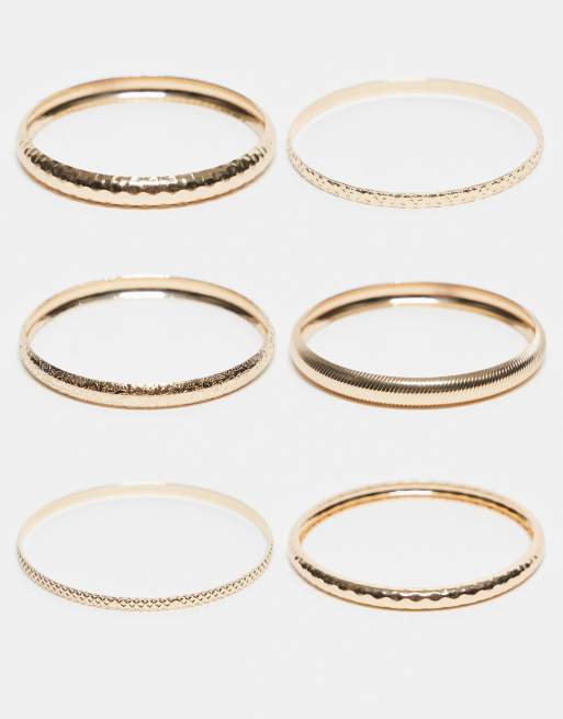 Pack de 6 pulseras doradas finas sin cierres con diseños variados repujados de ASOS DESIGN Curve
