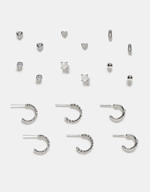Pack de 9 pares de pendientes plateados con diseños de aro y botón grunge de River Island
