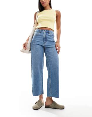 hepburn low rise distressed baggy jeans in mid wash blue