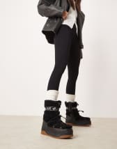 Hunter Intrepid tall buckle snow boots in white | ASOS