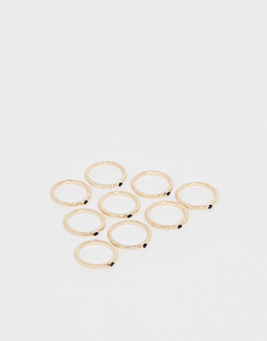 Pakke med 9 guldfarvede fine ringe med små sten fra ASOS DESIGN