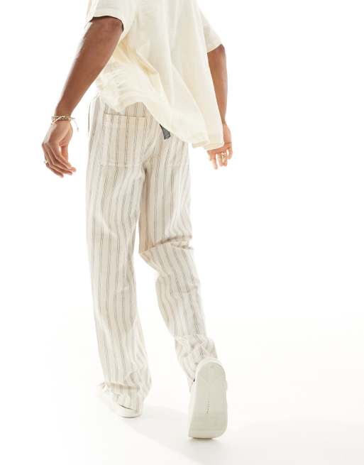 Pantalones a rayas holgados con cinturilla elástica de tejido texturizado de lino de ASOS DESIGN , 4 de 6