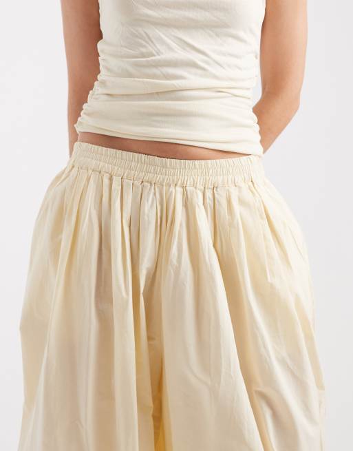 Pantalones amarillo pastel de corte globo con bajos ajustados de tejido liso de AWARE, 3 de 5