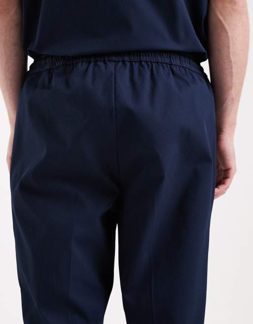 Pantalones azul marino de corte tapered de ASOS DESIGN (parte de un conjunto), 5 de 5