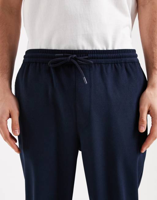 Pantalones azul marino de corte tapered de ASOS DESIGN (parte de un conjunto), 5 de 5