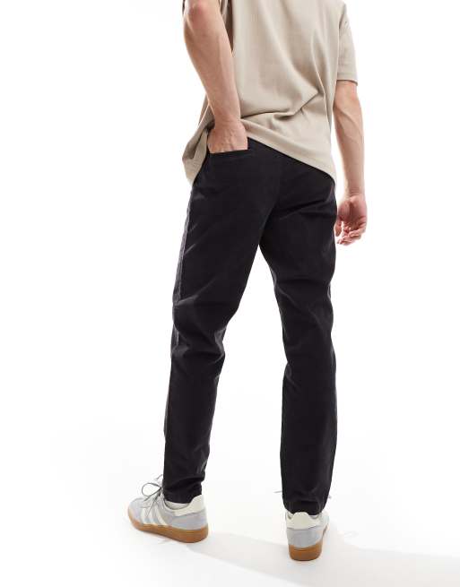 Pantalones azul marino de corte tapered de pana de ASOS DESIGN ASOS