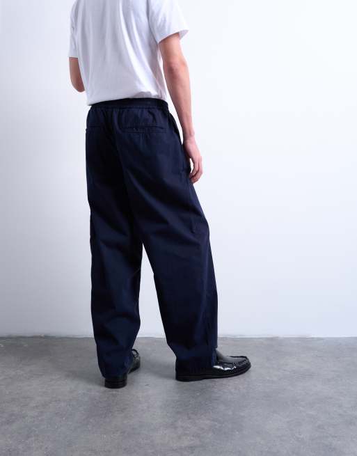 Pantalones azul marino de corte tapered de sarga de Topman, 4 de 5