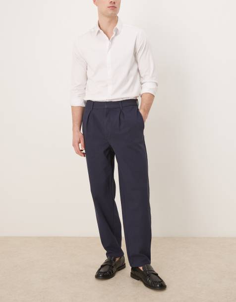 Pantalones azul marino de corte tapered extragrande con pinzas de ASOS DESIGN - view 1