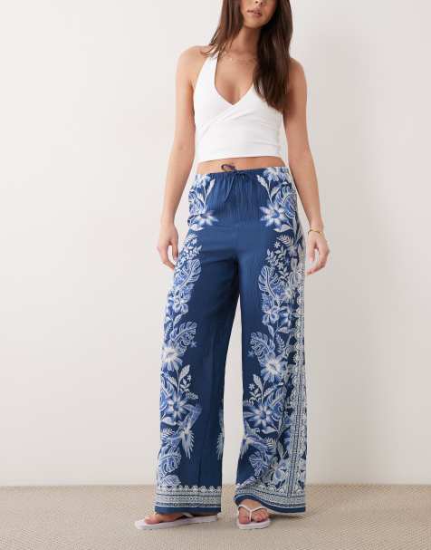 Pantalones azules de pernera ancha con estampado botánico de New Look - view 1