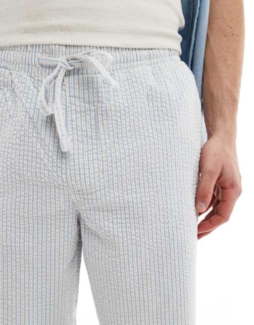 Pantalones azules y blancos a rayas de corte ancho con cintura elástica de sirsaca de ASOS DESIGN, 3 de 5