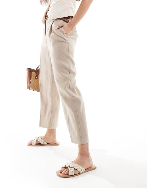 Pantalones beis de corte slim con cinturilla elástica de lino de Mango