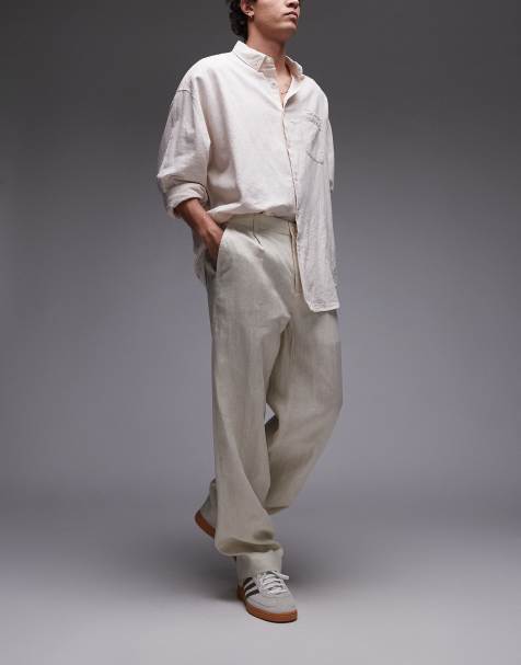 Pantalones beis de corte tapered de lino premium de Mango - view 1