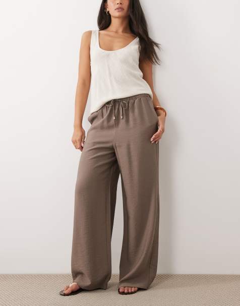 Pantalones beis de pernera ancha de tejido liso de New Look - view 1