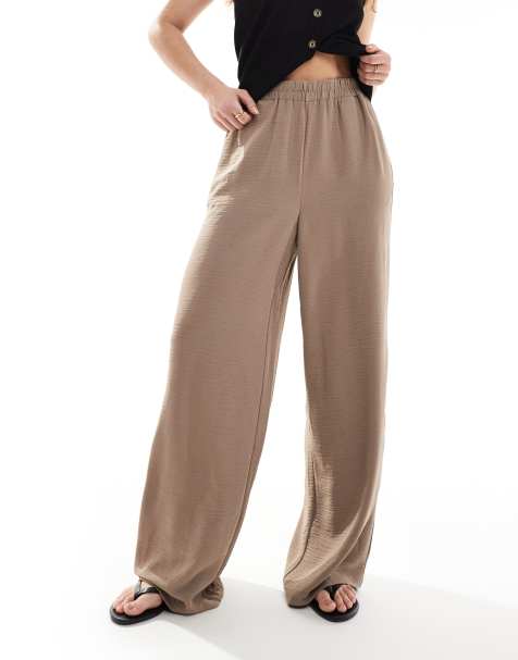 Pantalones beis fósil de pernera ancha con cintura elástica de Pieces - view 1
