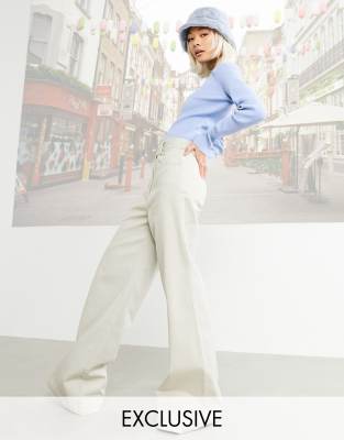 Pantalones beis superacampanados de COLLUSION
