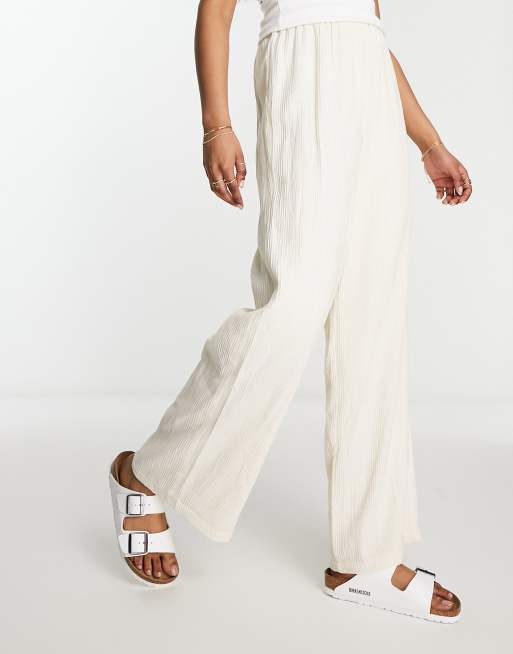 Pantalones blanco hueso de pernera ancha con cintura elástica de mezcla de lino de Lola May
