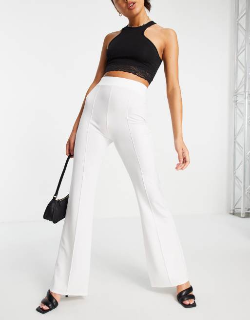 Pantalones blancos de campana de encaje transparente de ASOS Luxe