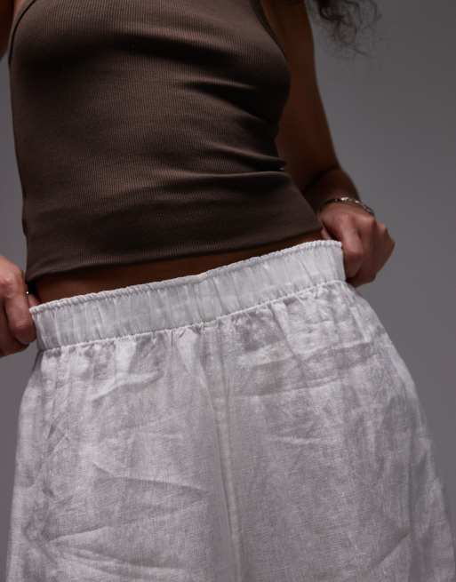 Pantalones blancos de corte palazzo con cinturilla sin cierres de lino puro de ARKET, 3 de 5