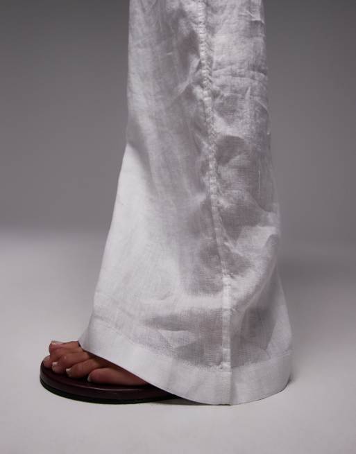Pantalones blancos de corte palazzo con cinturilla sin cierres de lino puro de ARKET, 5 de 5