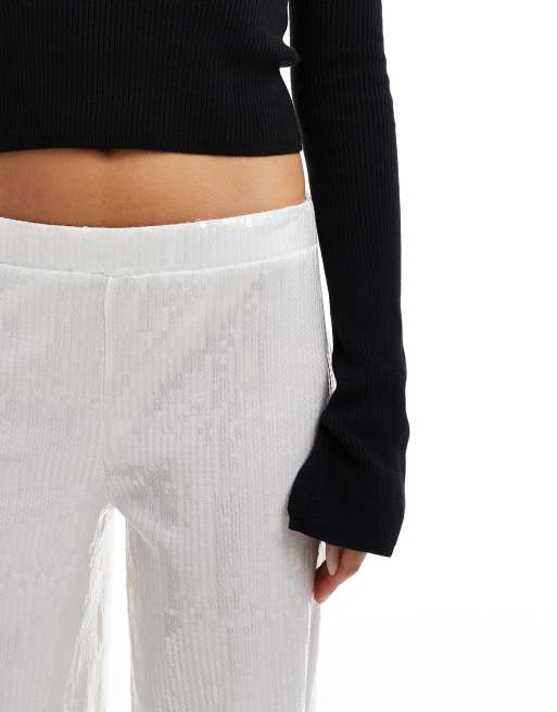 Pantalones blancos de pernera ancha de lentejuelas transparentes de ASOS DESIGN, 5 de 5