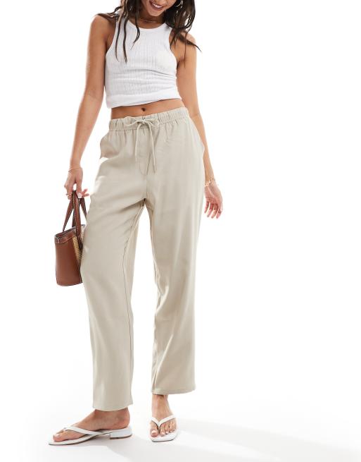 Pantalones capri beis holgados de tejido efecto lino de Mango