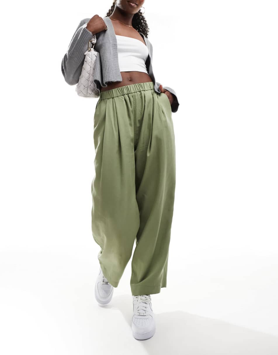 Pantalones caqui lavado de estilo casual sin cierres con pinzas premium de ASOS DESIGN - view 1
