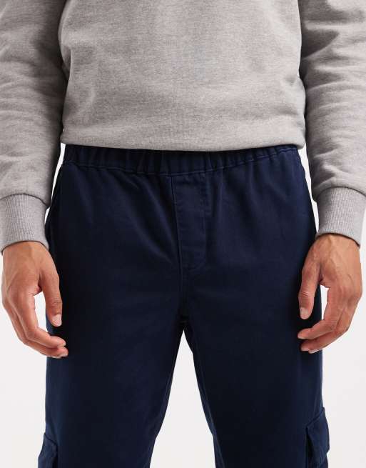 Pantalones cargo azul marino de corte tapered sin cierres de ASOS DESIGN, 5 de 5