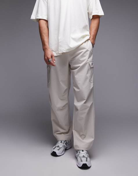Pantalones cargo blanco hueso de tejido antidesgarros de New Balance - view 1